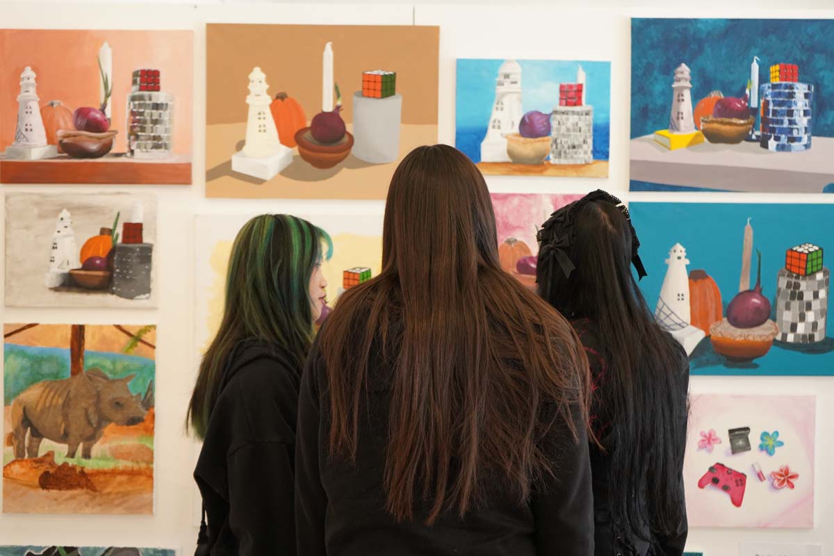 Students attend CHC Fall student art exhibit.