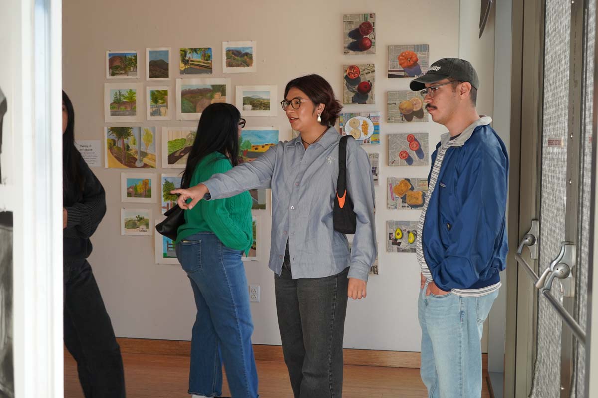 Students attend CHC Fall student art exhibit.