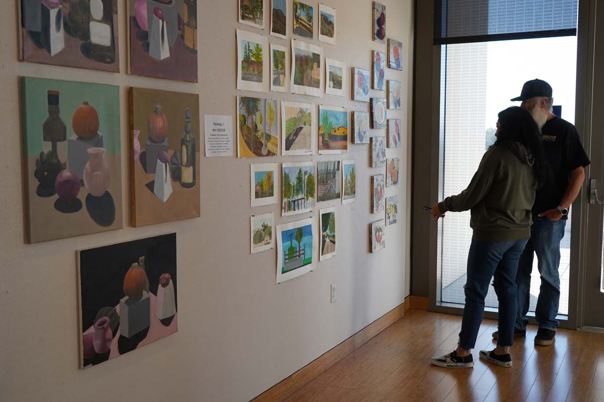 Students attend CHC Fall student art exhibit.