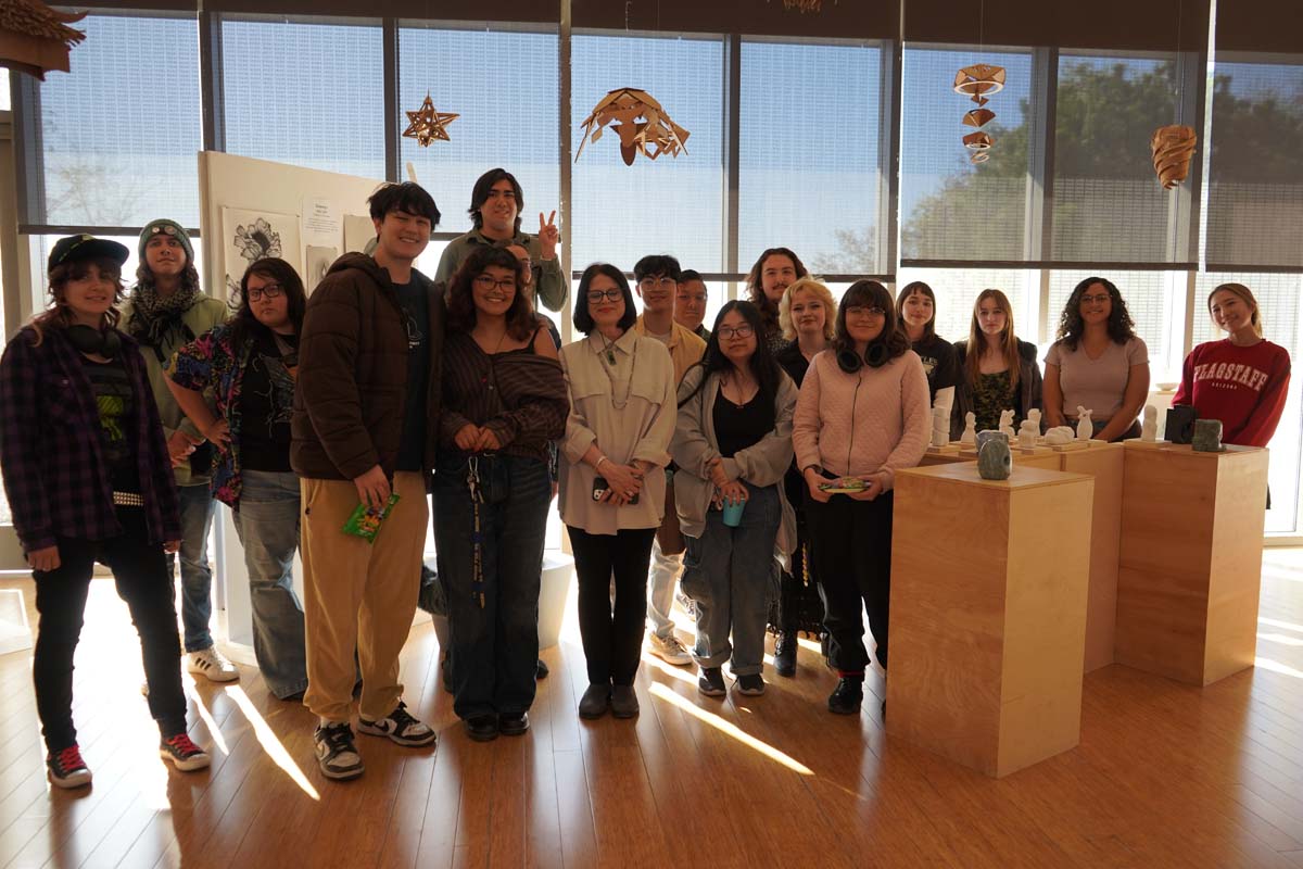 Students attend CHC Fall student art exhibit.