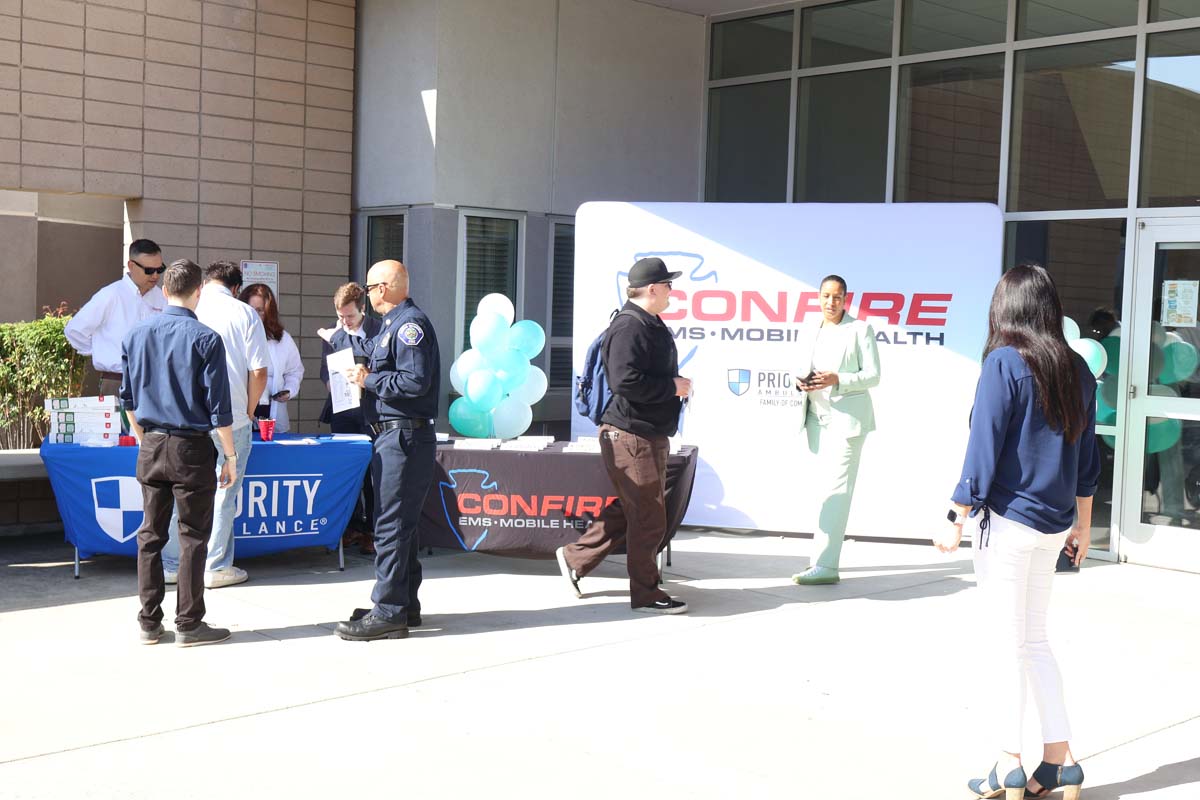 People enjoying the Confire Pioneering Partnership for EMT Training and Employment event.