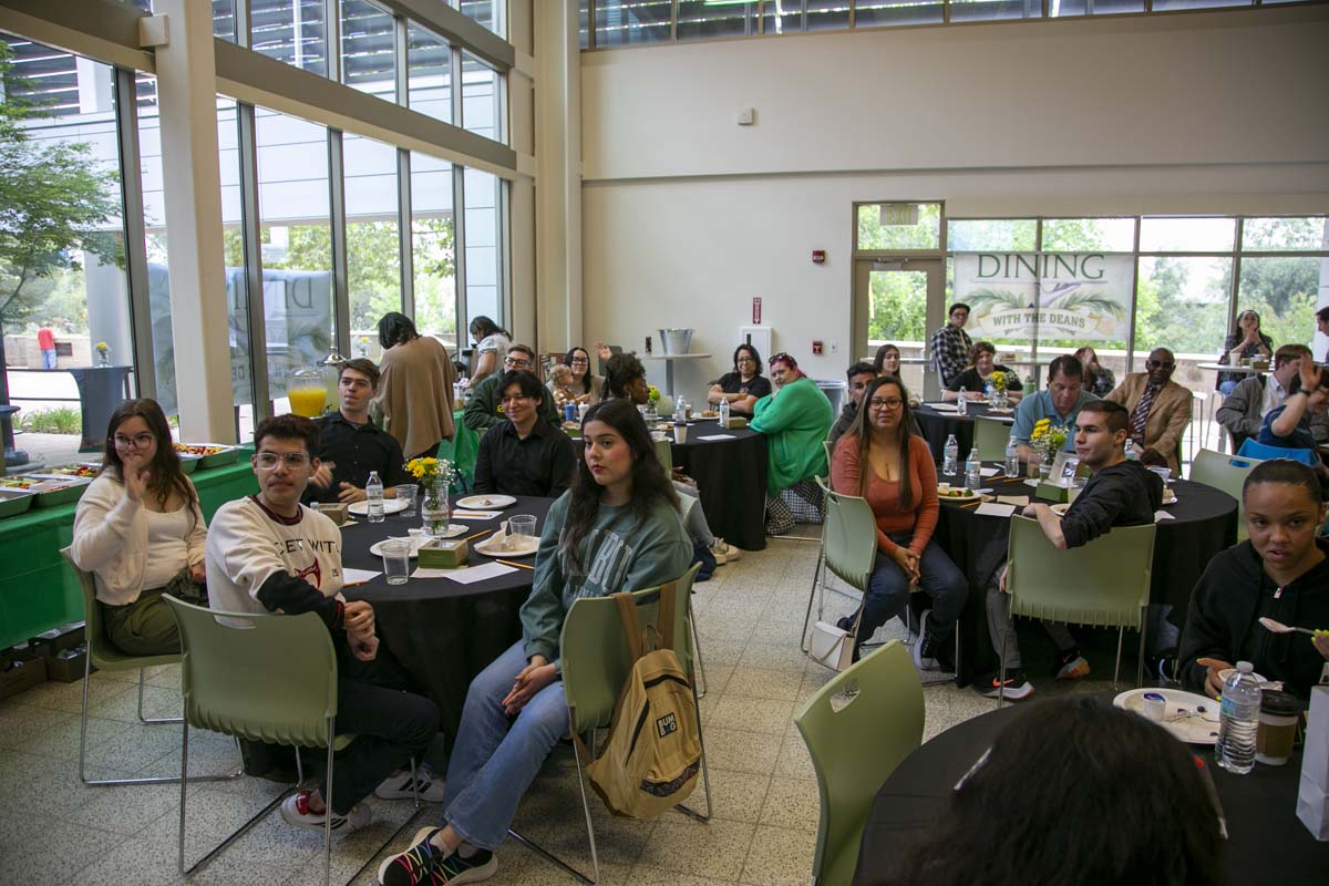 Students celebrate making deans list at event.