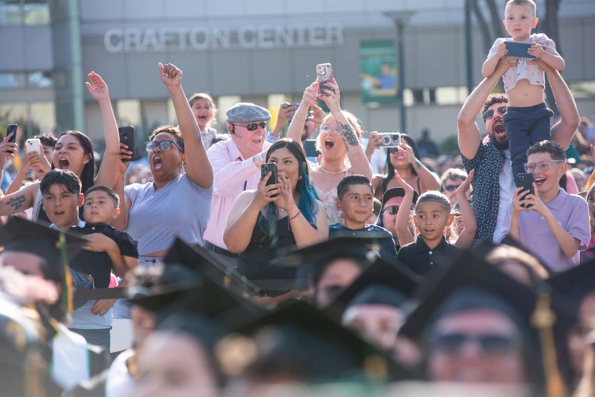 Graduates walk across stage at CHC Commencement 2024.
